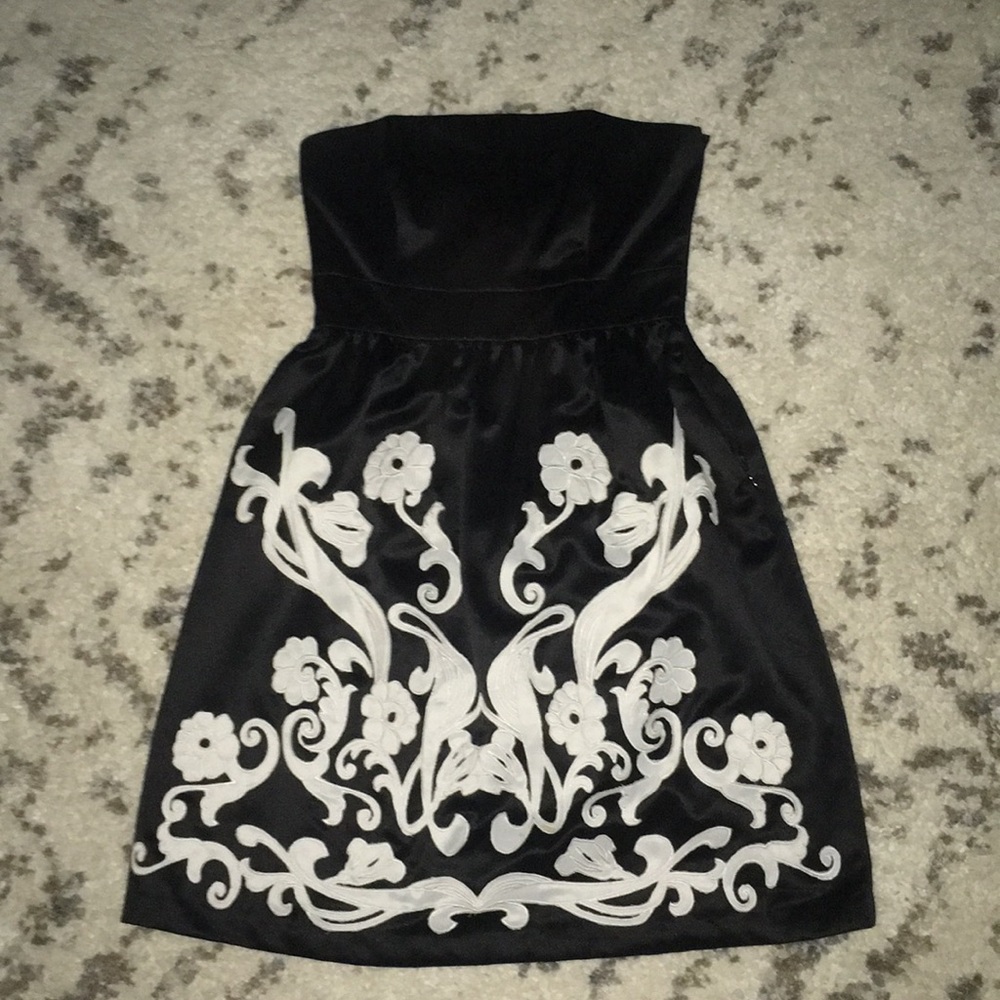 black dress with white (floral) design.